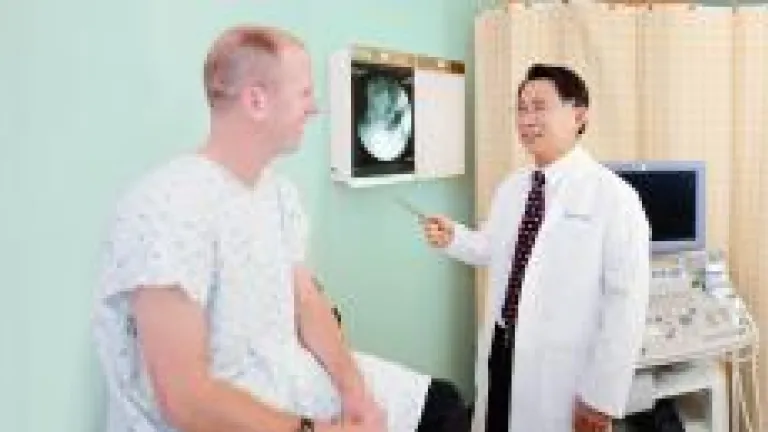 Dr. Tom Lue with patient