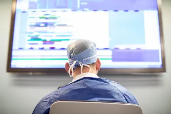 over the shoulder view of Dr. Breyer looking at a screen