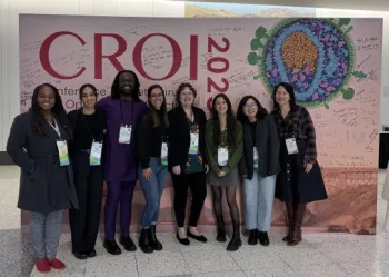 group of people in front of CROI sign