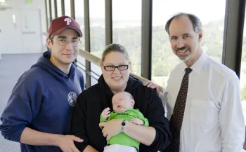 Dr. Baskin with patient and family