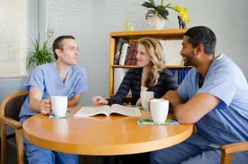 Fellows discussing Grand Round issues