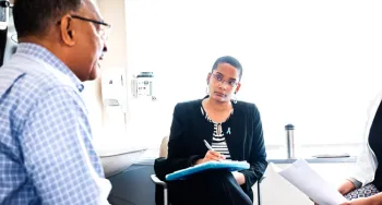 Dr. Palmer listens in during patient doctor visit