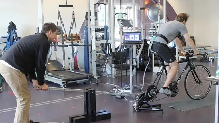 Professor Sanford using a lever system to generate an oscillation event at progressively increasing magnitudes.