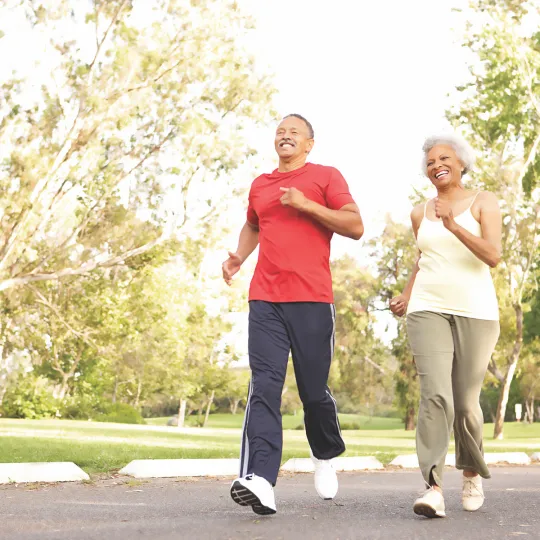 Older couple walking briskly